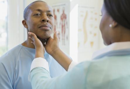 African American man getting examined in the doctors office