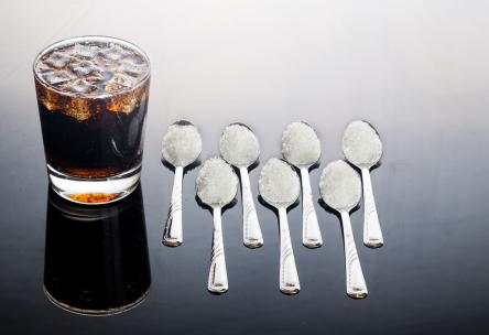 drink and spoons with sugar