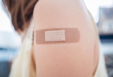 woman with bandaid on shoulder