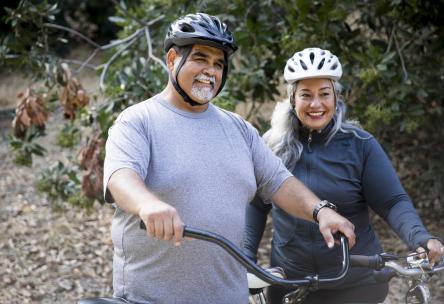 middle aged couple on bikes