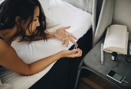Woman testing her blood sugar.